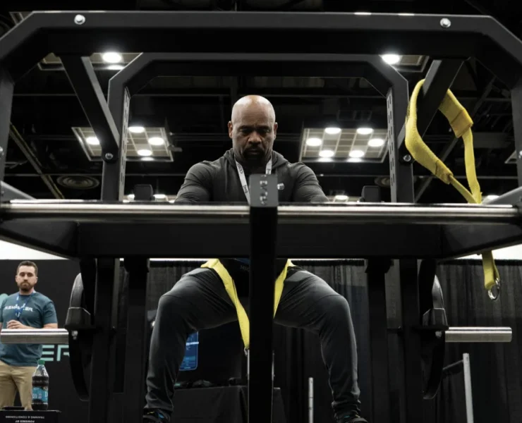 A man testing out the new ARMR plate-loaded machine from PLAE.